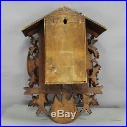 Black forest carved wood cuckoo clock with large eagle on top