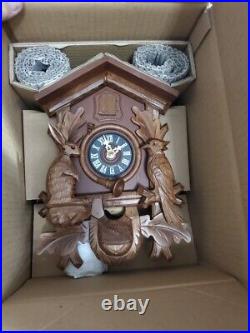 Carved 1-day cuckoo clock with stag head, rabbit and wood-pecker 43cm by Hurbert