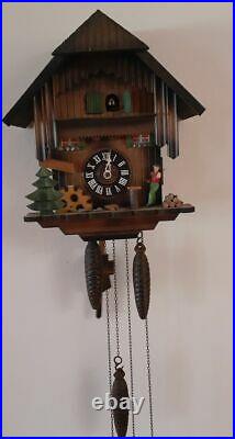 German Black Forest made Vintage Musical Wood Chopper Cuckoo Clock for Repairs