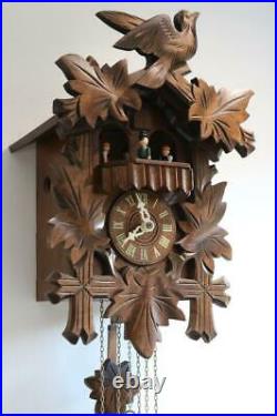 MODERN MUSICAL CUCKOO CLOCK with DANCING PEOPLE CAROUSEL excellent condition
