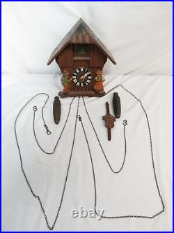 Vintage Hubert Herr German Cuckoo Clock Chalet Style Wood Carved Man & Woman