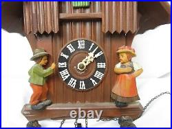 Vintage Hubert Herr German Cuckoo Clock Chalet Style Wood Carved Man & Woman