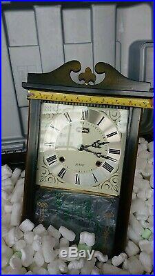 Wall mounted vintage old fashioned clock traditional classic design