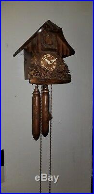 Wood Hauling Horse And Wood Chopper Cuckoo clock, wooden weights approx 8 tall