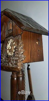 Wood Hauling Horse And Wood Chopper Cuckoo clock, wooden weights approx 8 tall